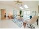 Living room with vaulted ceilings, skylights, and view of pool at 3440 Downing W St, Englewood, FL 34224