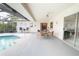 Relaxing screened-in pool and patio area with outdoor seating at 3440 Downing W St, Englewood, FL 34224