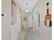 Bright hallway with tile floors and access to other rooms at 3275 Osprey Ln, Port Charlotte, FL 33953