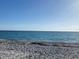 Serene beach view with tranquil ocean and sandy shore at 3275 Osprey Ln, Port Charlotte, FL 33953