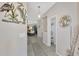 Open hallway with tile floors and views of dining area at 3275 Osprey Ln, Port Charlotte, FL 33953