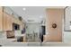 Modern kitchen with light wood cabinets, stainless steel appliances, and a breakfast nook at 3275 Osprey Ln, Port Charlotte, FL 33953
