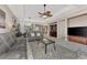 Comfortable living room with gray couches, a coffee table, and ceiling fan at 3275 Osprey Ln, Port Charlotte, FL 33953