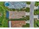 An overhead view of houses with various roof styles and neatly landscaped yards at 3275 Osprey Ln, Port Charlotte, FL 33953