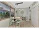 Bright dining area with light wood table and chairs near kitchen at 3275 Osprey Ln, Port Charlotte, FL 33953