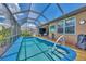 Relax and enjoy the sun by the pool with a spacious patio at 3275 Osprey Ln, Port Charlotte, FL 33953