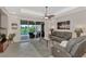 Spacious living room with sliding doors leading to a pool and patio area at 3275 Osprey Ln, Port Charlotte, FL 33953