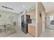Modern kitchen with stainless steel appliances and light wood cabinets at 3275 Osprey Ln, Port Charlotte, FL 33953
