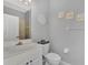 Small bathroom with toilet, sink, and mirror at 3275 Osprey Ln, Port Charlotte, FL 33953