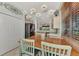 Kitchen breakfast nook with wood table and light green chairs at 3275 Osprey Ln, Port Charlotte, FL 33953
