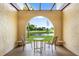 Private patio with water views and seating area at 78 Boundary Blvd # 192, Rotonda West, FL 33947