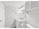 Bright bathroom with white vanity and fixtures at 78 Boundary Blvd # 192, Rotonda West, FL 33947