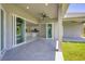 Open concept patio with kitchen view and sliding doors at 8111 Arlewood Cir, Port Charlotte, FL 33981