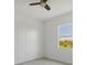 Simple bedroom with light walls, hardwood floors and ceiling fan at 8111 Arlewood Cir, Port Charlotte, FL 33981
