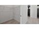 Walk in closet and bathroom with double shower at 8111 Arlewood Cir, Port Charlotte, FL 33981