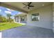 Covered patio with ceiling fan and view of backyard at 8111 Arlewood Cir, Port Charlotte, FL 33981