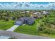 Single-Gathering home with a large yard and attached garage; located in a quiet residential neighborhood at 8111 Arlewood Cir, Port Charlotte, FL 33981