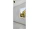 Bright bedroom with large window offering a view of lush greenery at 8111 Arlewood Cir, Port Charlotte, FL 33981