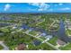 Aerial view of a waterfront community with houses and canals at 8111 Arlewood Cir, Port Charlotte, FL 33981