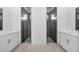Modern bathroom with double vanity, white cabinets and large walk in shower at 8111 Arlewood Cir, Port Charlotte, FL 33981