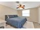 Spacious bedroom with a king-size bed and ceiling fan at 2051 Mississippi Ave, Englewood, FL 34224