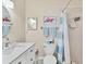 Clean bathroom with a shower/tub combo and updated vanity at 6796 Gasparilla Pines Blvd # 48, Englewood, FL 34224