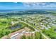 Aerial view of a community with waterfront access and lush landscaping at 6796 Gasparilla Pines Blvd # 48, Englewood, FL 34224