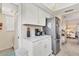 Kitchen boasts stainless steel appliances and white cabinets at 6796 Gasparilla Pines Blvd # 48, Englewood, FL 34224