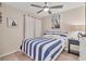 Guest bedroom with a full-size bed and coastal decor at 6796 Gasparilla Pines Blvd # 48, Englewood, FL 34224
