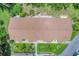 Aerial view showing the condo building's roof and surrounding landscape at 6796 Gasparilla Pines Blvd # 48, Englewood, FL 34224