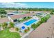 Community pool and surrounding condos at 6796 Gasparilla Pines Blvd # 48, Englewood, FL 34224