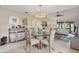 Bright dining area with glass table and seating for four at 6796 Gasparilla Pines Blvd # 48, Englewood, FL 34224