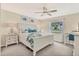 Spacious main bedroom with king-size bed and private access to bathroom at 6796 Gasparilla Pines Blvd # 48, Englewood, FL 34224