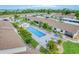 Community pool and surrounding condos with lush landscaping at 6796 Gasparilla Pines Blvd # 48, Englewood, FL 34224