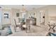 Casual dining area with glass table and seating for four at 6796 Gasparilla Pines Blvd # 48, Englewood, FL 34224