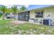 Spacious backyard with a screened patio at 6796 Gasparilla Pines Blvd # 48, Englewood, FL 34224