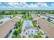 Aerial view of community with central pool at 6796 Gasparilla Pines Blvd # 48, Englewood, FL 34224