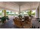 Comfortable wicker seating area on a community patio at 8409 Placida Rd # 308, Placida, FL 33946