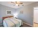 Comfortable bedroom with a double bed and ceiling fan at 8409 Placida Rd # 308, Placida, FL 33946