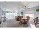 Bright living room with comfy seating, large windows, and access to a balcony at 8409 Placida Rd # 308, Placida, FL 33946
