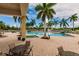 Refreshing community pool with lounge chairs and patio seating at 8409 Placida Rd # 308, Placida, FL 33946