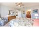 Main bedroom with king bed, ensuite bath access, and charming decor at 8409 Placida Rd # 308, Placida, FL 33946