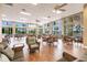 Spacious community room with hardwood floors and large windows at 8409 Placida Rd # 308, Placida, FL 33946
