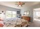 Main bedroom with king bed, dresser, and ceiling fan at 8409 Placida Rd # 308, Placida, FL 33946