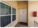 Unit entryway with door and windows at 8409 Placida Rd # 308, Placida, FL 33946