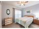 Bright bedroom with a double bed, dresser, and window at 8409 Placida Rd # 308, Placida, FL 33946