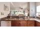 Kitchen with granite countertops, wooden cabinets, and stainless steel appliances at 8409 Placida Rd # 308, Placida, FL 33946