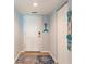 Bright entryway with white door, tile flooring, and coat closet at 8409 Placida Rd # 308, Placida, FL 33946