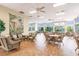 Bright community room with wicker furniture and hardwood floors at 8409 Placida Rd # 308, Placida, FL 33946