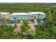 Aerial view of building, parking lot, and surrounding landscape at 8409 Placida Rd # 308, Placida, FL 33946